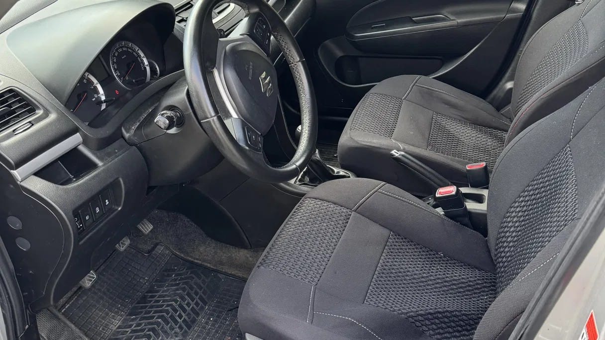 Suzuki Swift met Autostoel baby