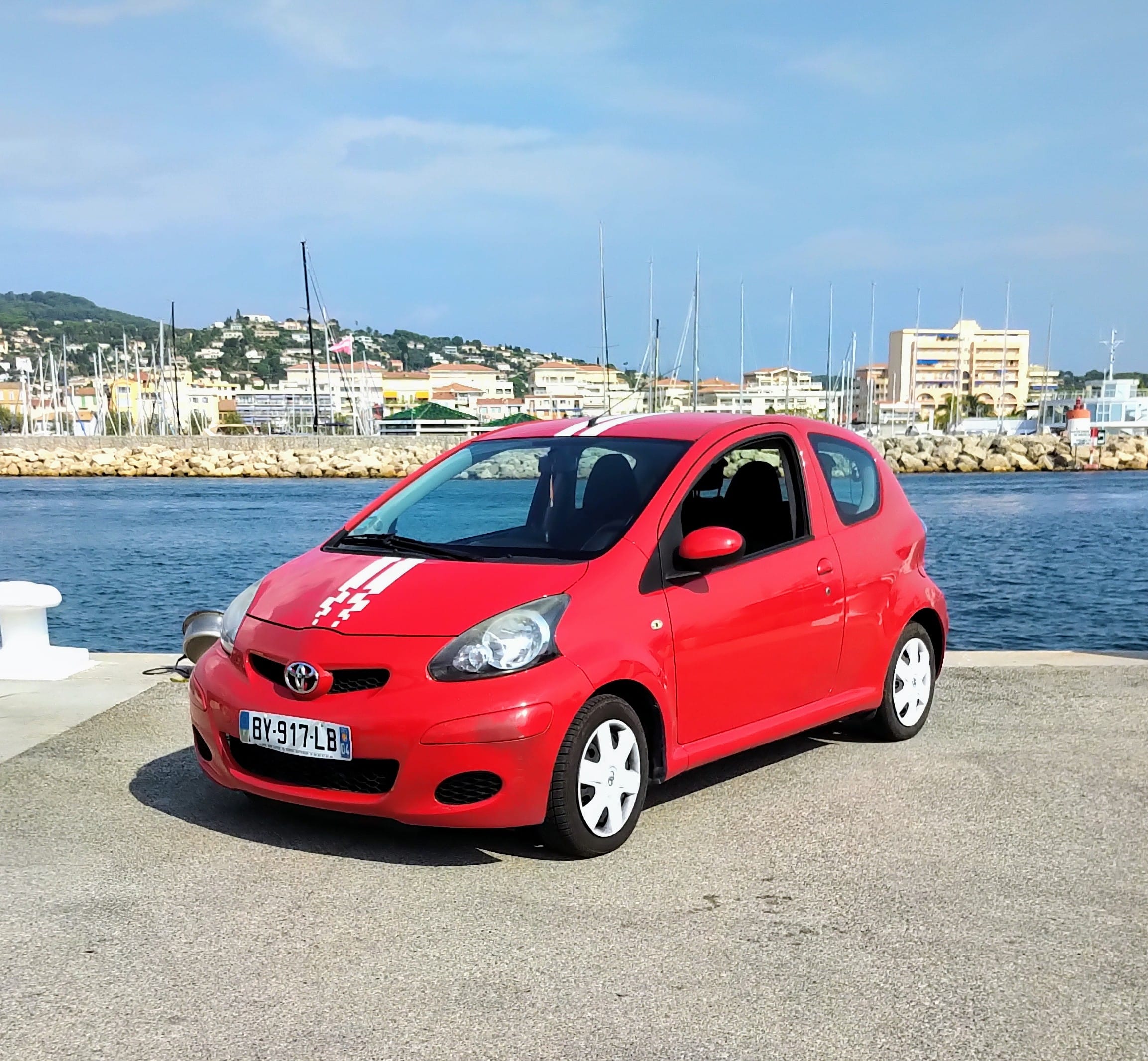 Toyota Aygo Livrée sur le lieu de votre choix, 2011, Essence 95